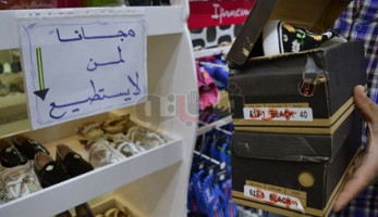 «الدنيا لسه بخير» محل أحذية يخصص ركنا مجانيا لغير القادرين (صور) (فيتشر)
