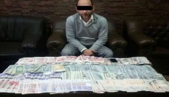 ضبط شخص لاتجاره غير المشروع في النقد الأجنبي بالمنيا